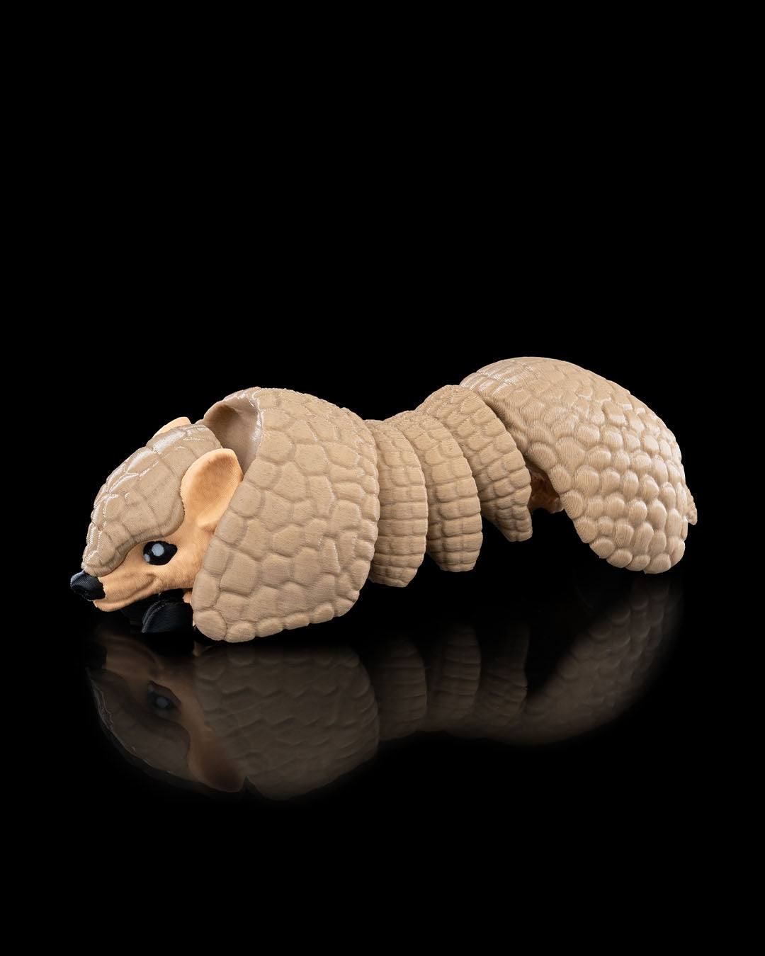 3D-printed Armadillo figurine, curled pose, side view